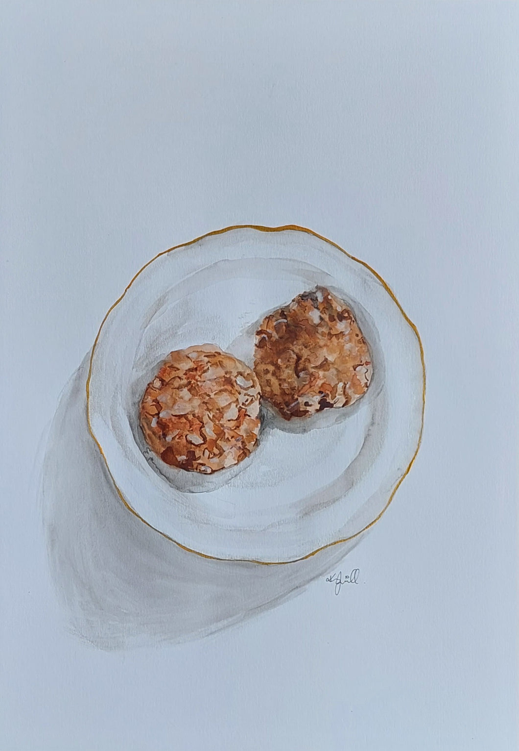 ANZAC biscuits on a gold rimmed plate